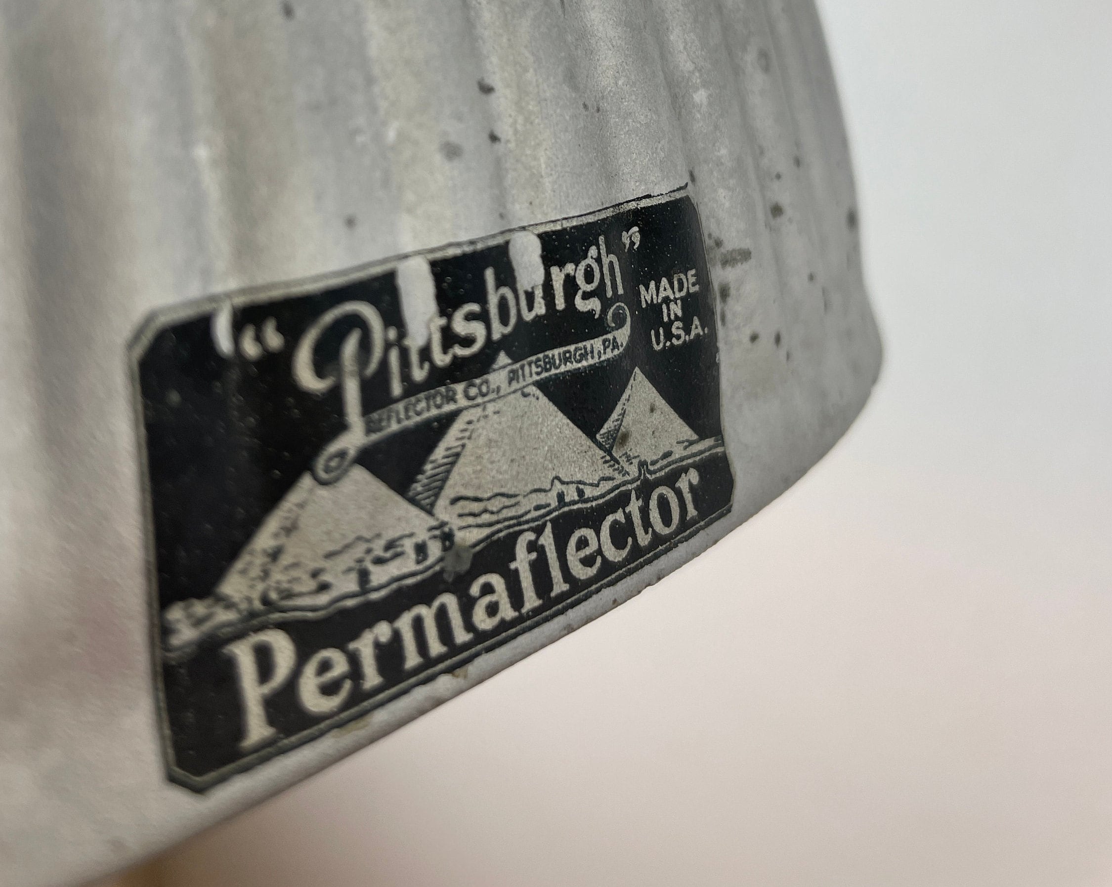 Vintage well worn Mercury Glass Pittsburgh Permaflector Gray ribbed XRay clamshell-shaped with interior reflective surface